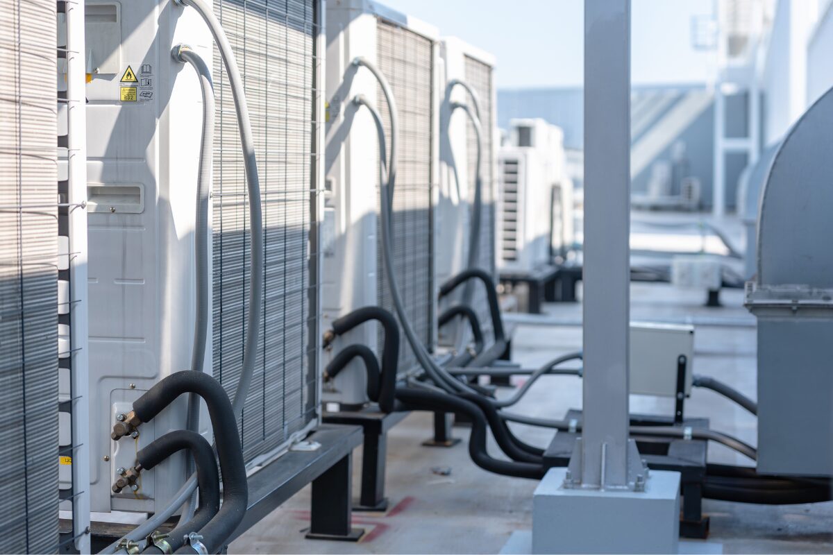 row of industrial ac units on a rooftop, external hvac system