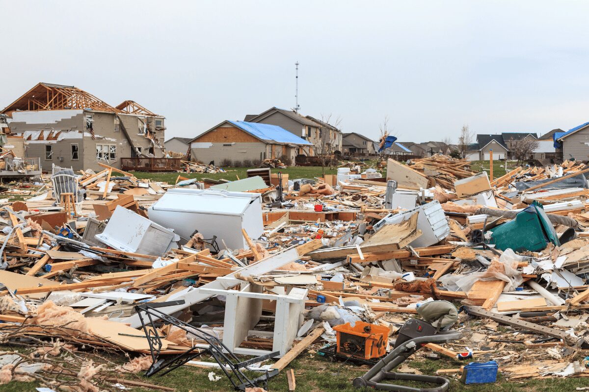 Washington, IL.png	Tornado damage in Washington, Illinois, with destroyed homes, exposed roof framing, scattered debris and temporary roof tarps.